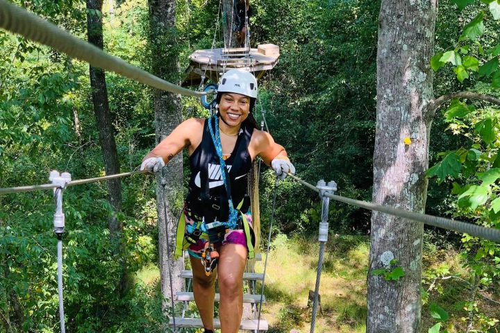 a person in a swing in a park