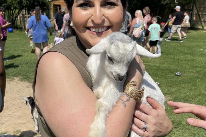 a couple of people that are standing in the grass