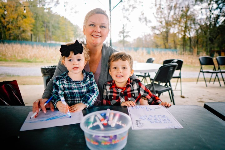 a young boy sitting at a table