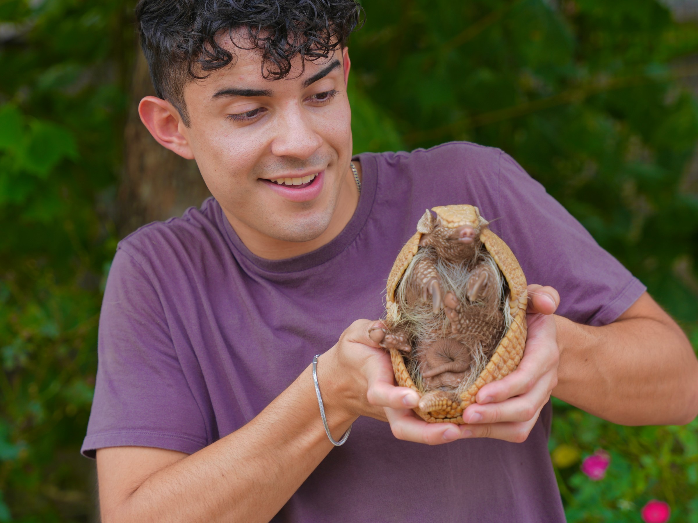 man holding armadillo