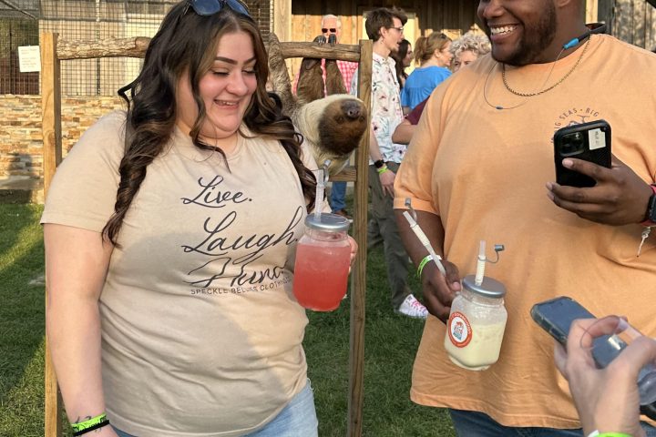 a group of people standing next to a person